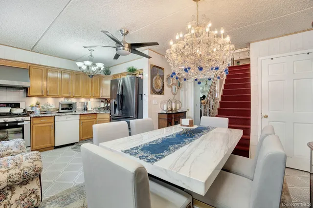 a kitchen with kitchen island a sink table and chairs