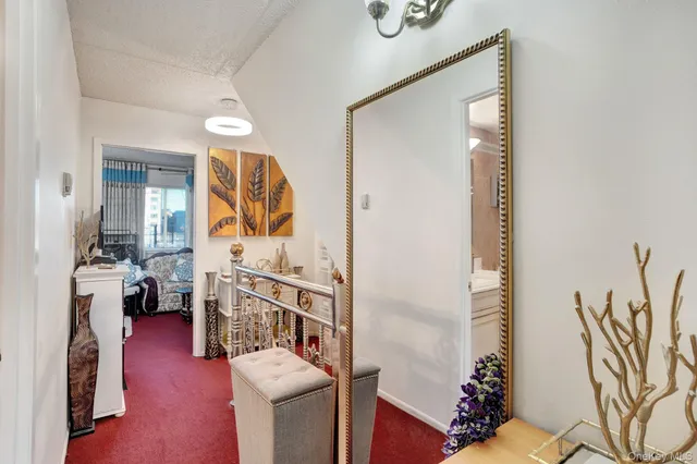 a view of living room filled with furniture and hardwood floor