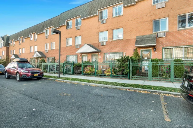 a view of a parked cars in front of a building