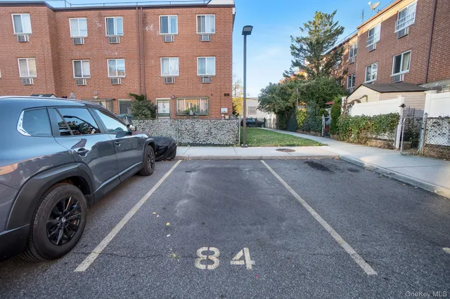 a view of a car parked in front of a building