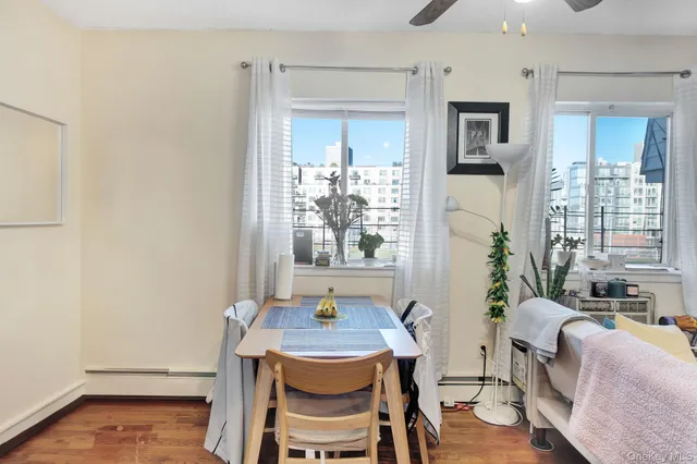 a view of a dining room with furniture window and outside view