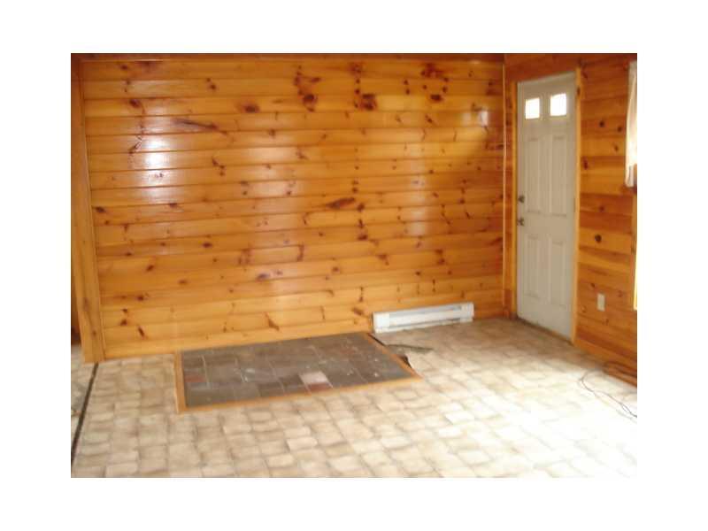 958 Howland Road Lagrange, ME 04453 - Photo 6 of 11 Living Room.