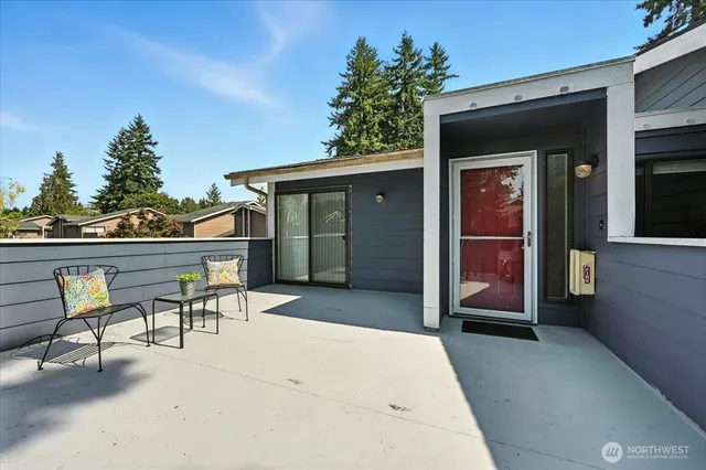 a patio with table and chairs