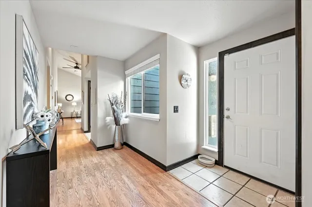 a view of a livingroom with wooden floor and stairs