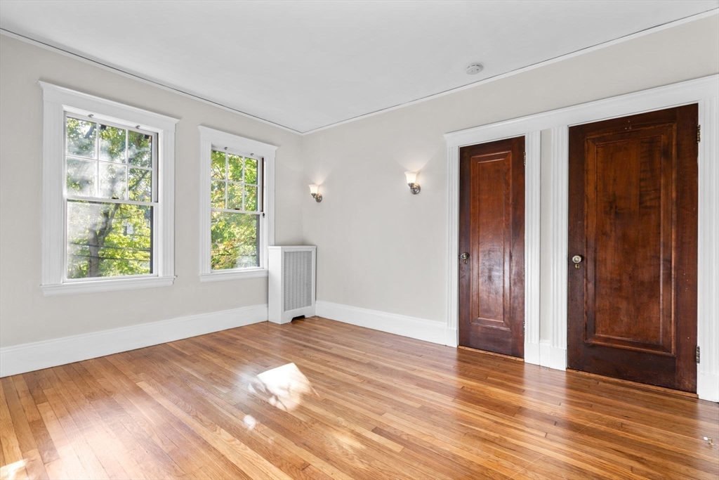 30-32 Goodrich Road Boston, MA 02130 - Photo 21 of 39 a view of empty room with wooden floor and fan