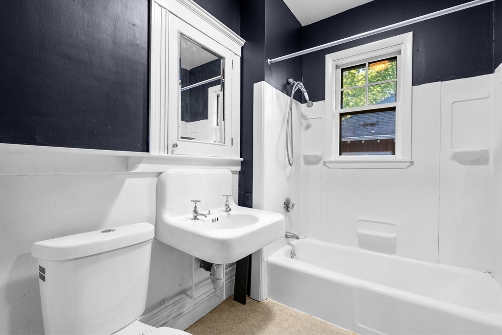 30-32 Goodrich Road Boston, MA 02130 - Photo 22 of 39 a bathroom with a sink a toilet and shower