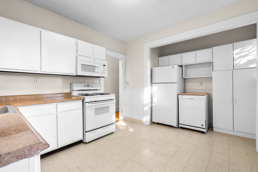 30-32 Goodrich Road Boston, MA 02130 - Photo 23 of 39 a kitchen with cabinets appliances and a counter space