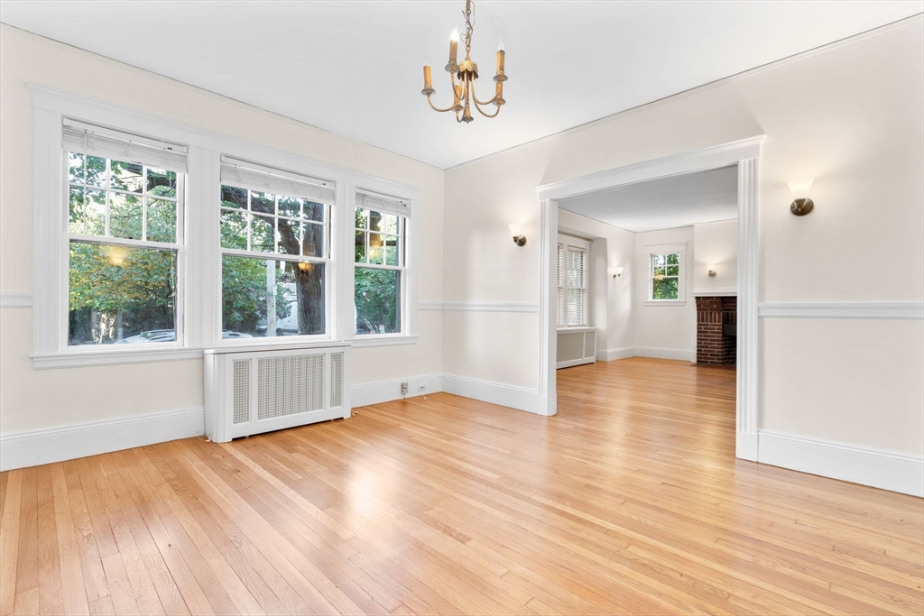 30-32 Goodrich Road Boston, MA 02130 - Photo 26 of 39 a view of an empty room with wooden floor and a window