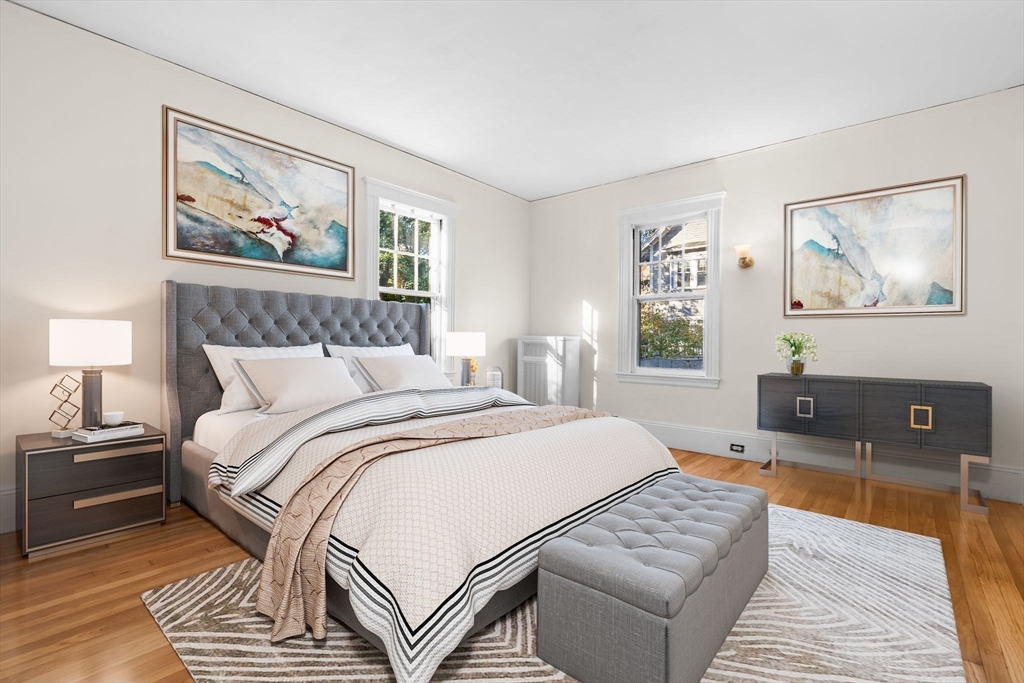 30-32 Goodrich Road Boston, MA 02130 - Photo 27 of 39 a bedroom with a large bed and a couch