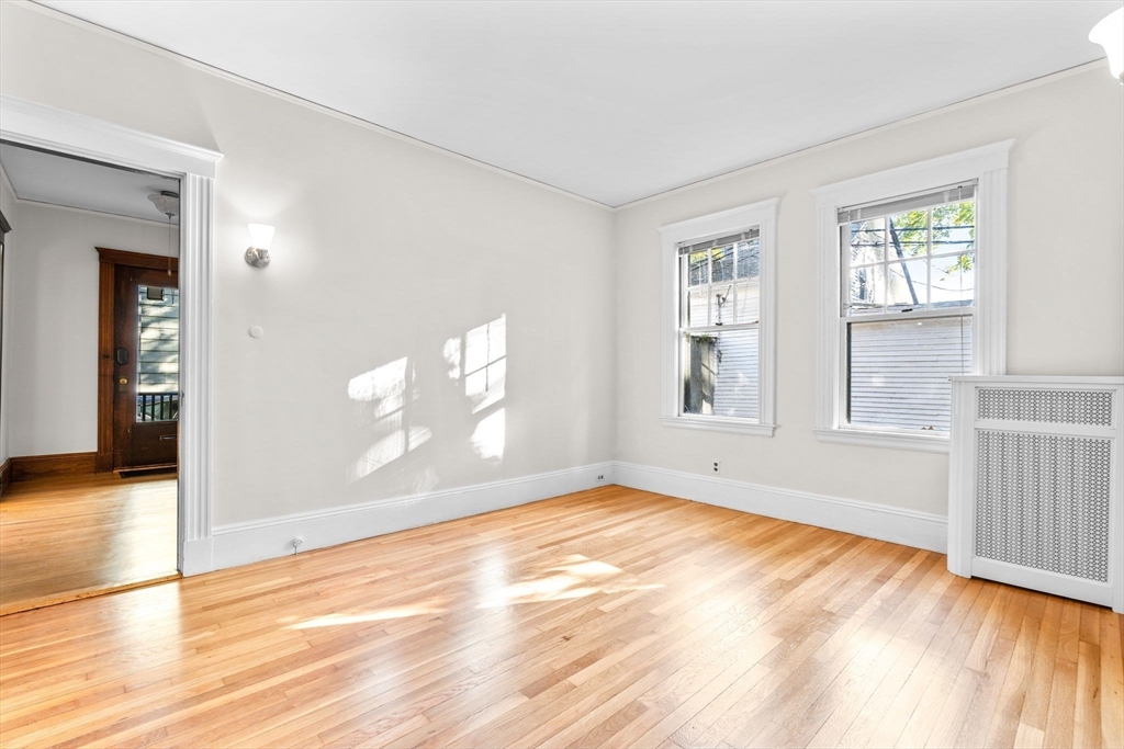 30-32 Goodrich Road Boston, MA 02130 - Photo 28 of 39 a view of empty room with wooden floor and fan