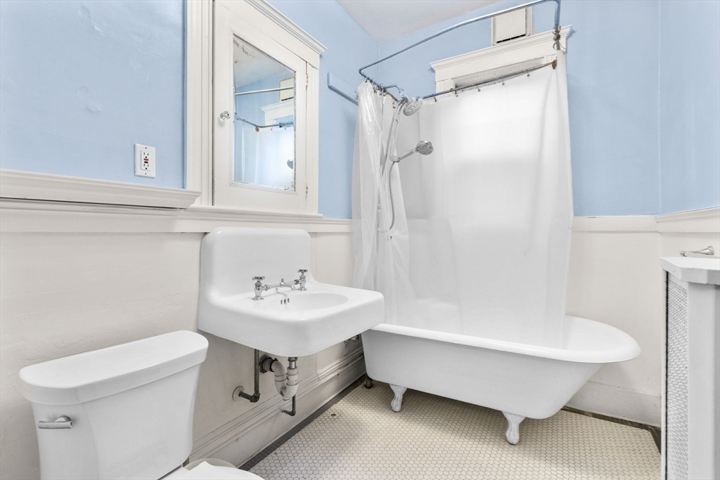 30-32 Goodrich Road Boston, MA 02130 - Photo 29 of 39 a bathroom with a sink toilet and shower