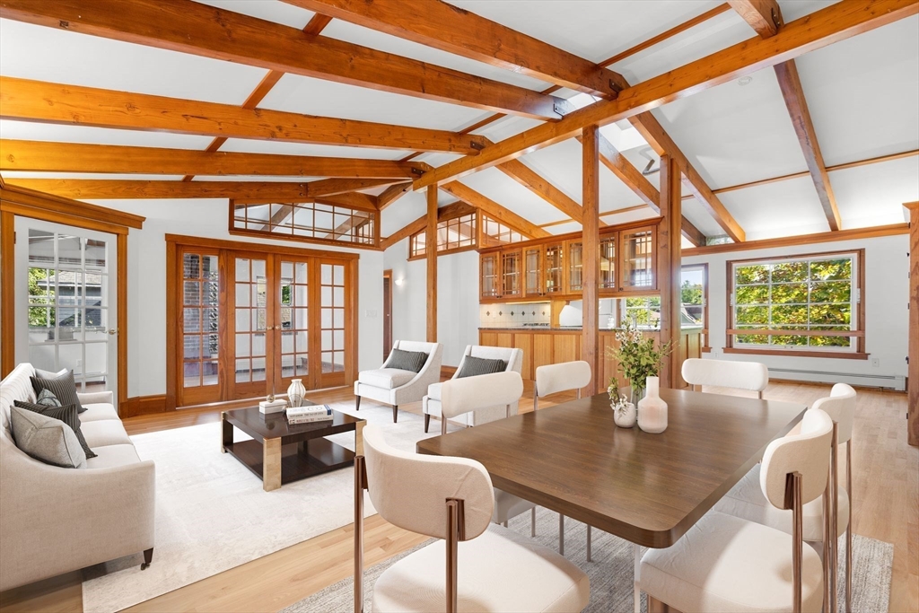 30-32 Goodrich Road Boston, MA 02130 - Photo 3 of 39 a dining room with furniture a flat screen tv and a large window