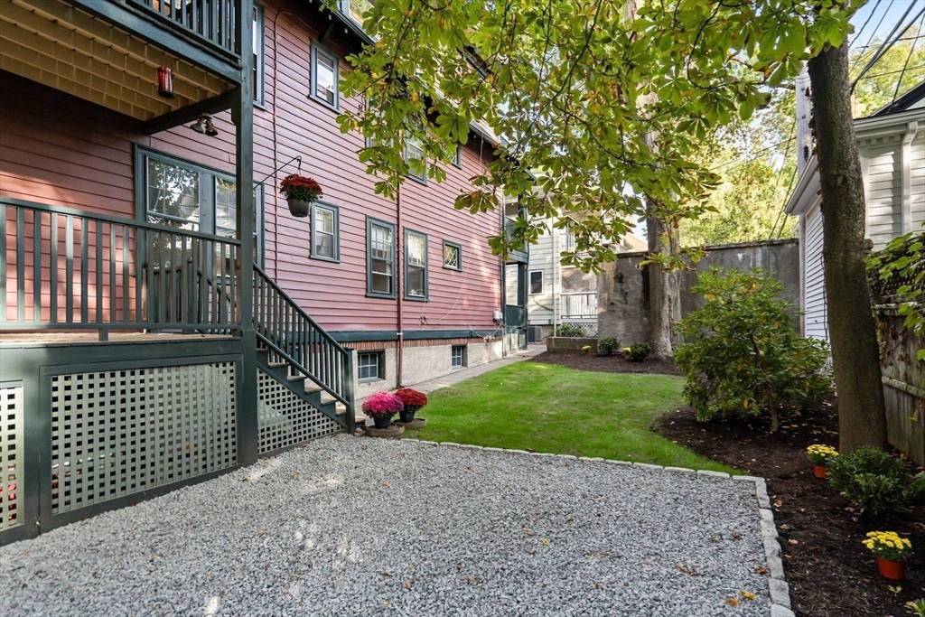 30-32 Goodrich Road Boston, MA 02130 - Photo 31 of 39 a front view of a house with garden