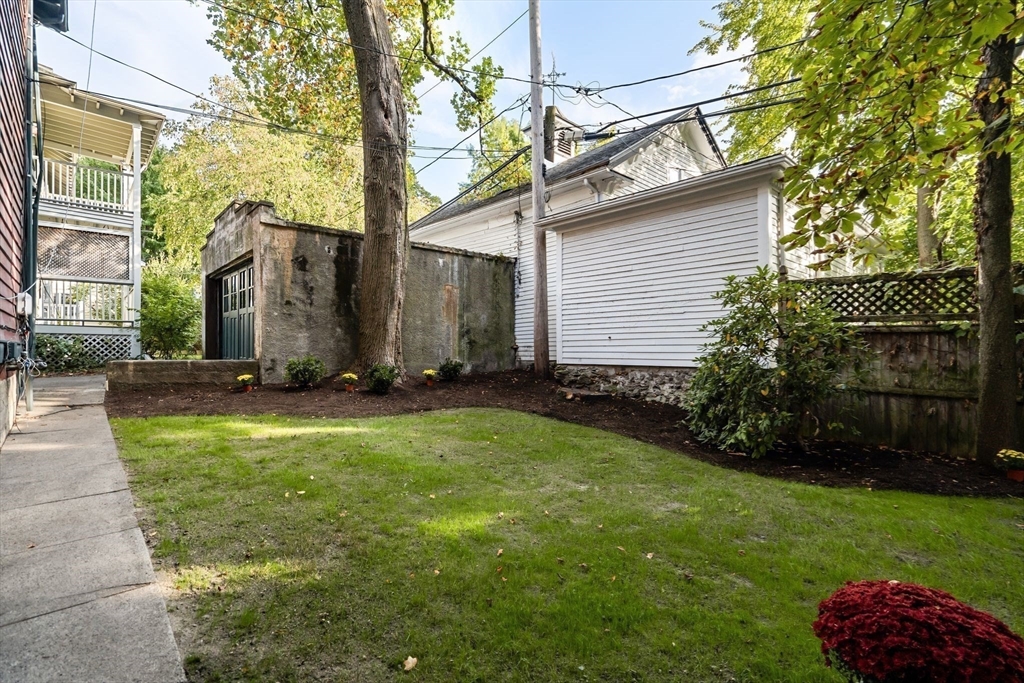30-32 Goodrich Road Boston, MA 02130 - Photo 34 of 39 a backyard of a house with lots of green space