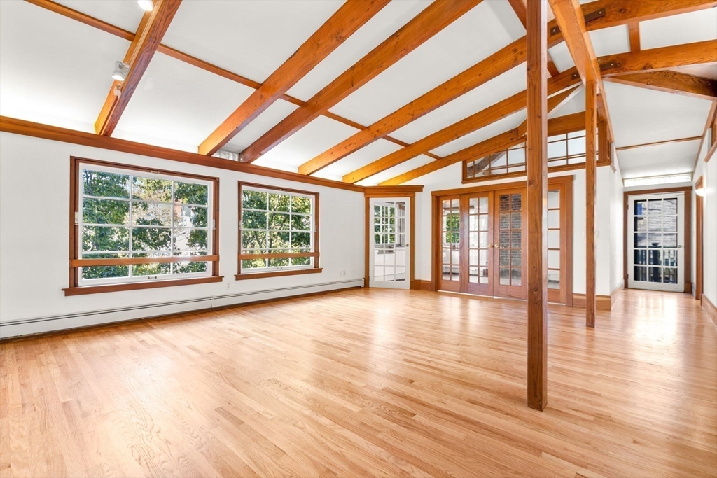 30-32 Goodrich Road Boston, MA 02130 - Photo 5 of 39 a view of empty room with wooden floor and fan