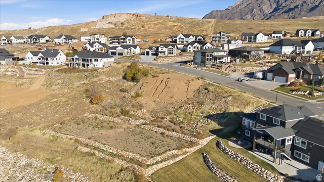 1211 West Fallow Way Ogden, UT 84414 - Photo 20 of 20 Aerial view of property and surrounding area with nearby suburban area and a mountainous background