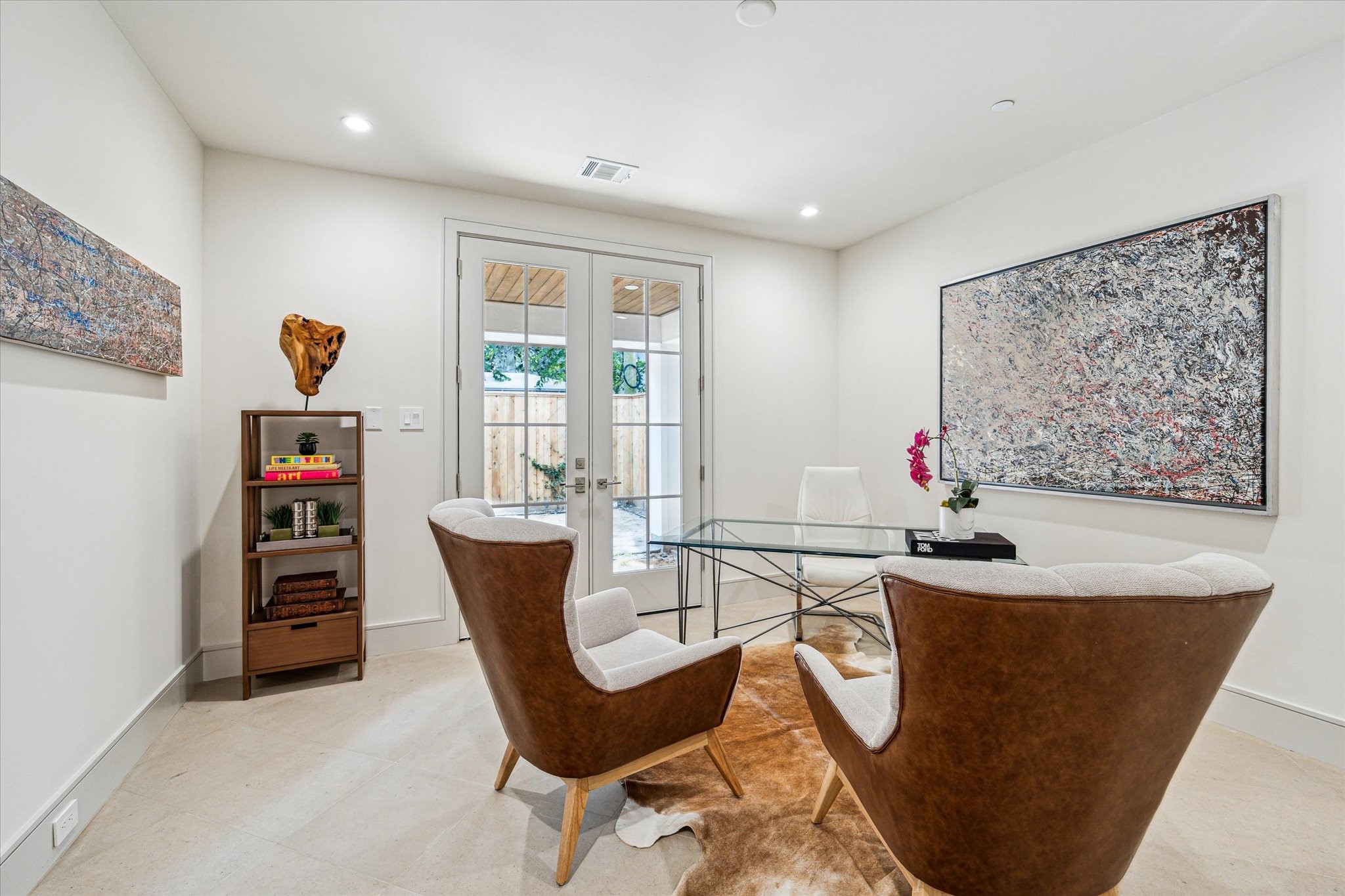 1215 West Pierce Street Houston, TX 77019 - Photo 12 of 40 The first floor bedroom can be used as a bedroom, office, or gym. The French doors open to the Pavilion or backyard, which will be customized to the new home-owner's preference with pavers or artificial turf.