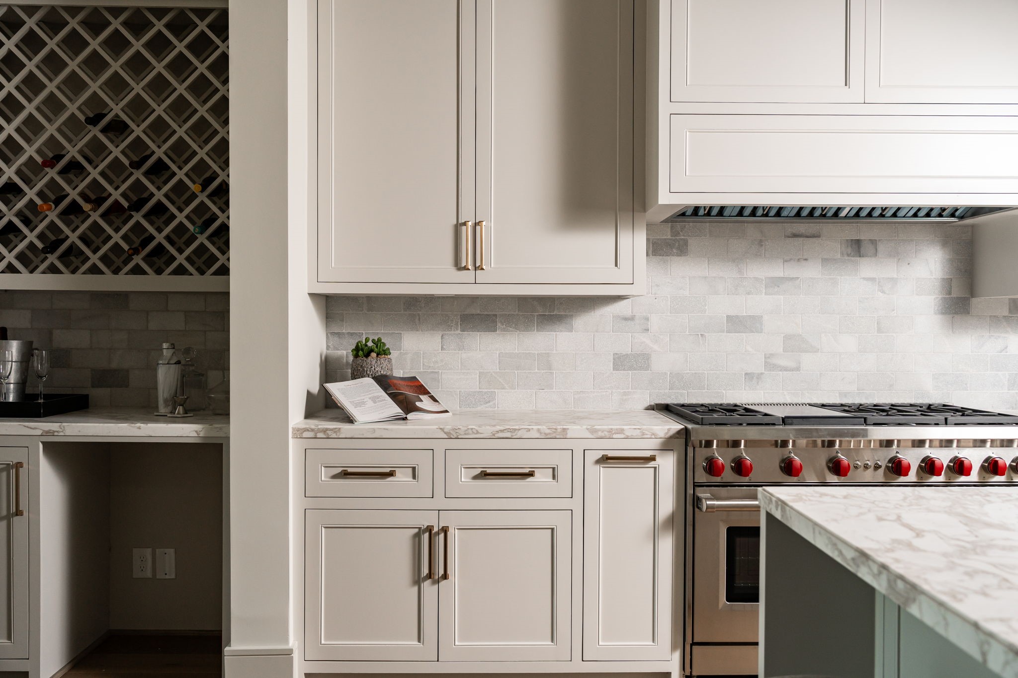 1215 West Pierce Street Houston, TX 77019 - Photo 22 of 40 All the kitchen cabinets feature inset, soft-close doors and drawers. The drawers have undermount hardware to keep them quiet and fully accessible. The back splash is tumbled marble, giving a subtle contrast to the countertops of the same polished marble.