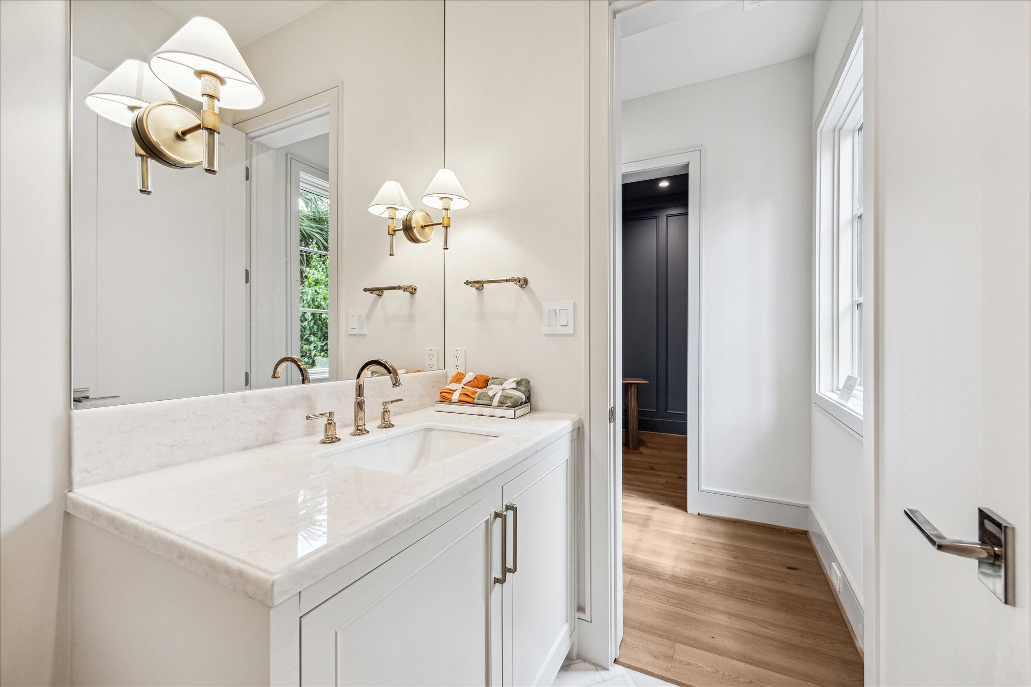 1215 West Pierce Street Houston, TX 77019 - Photo 24 of 40 Behind the kitchen, tucked discreetly out of sight, is the powder room. With plenty of space, marble counters, and polished gold fixtures, you and your guests will feel comfortable and taken care of.