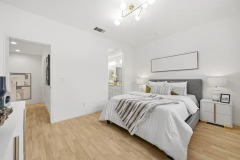 a bedroom with a bed and a walk in closet