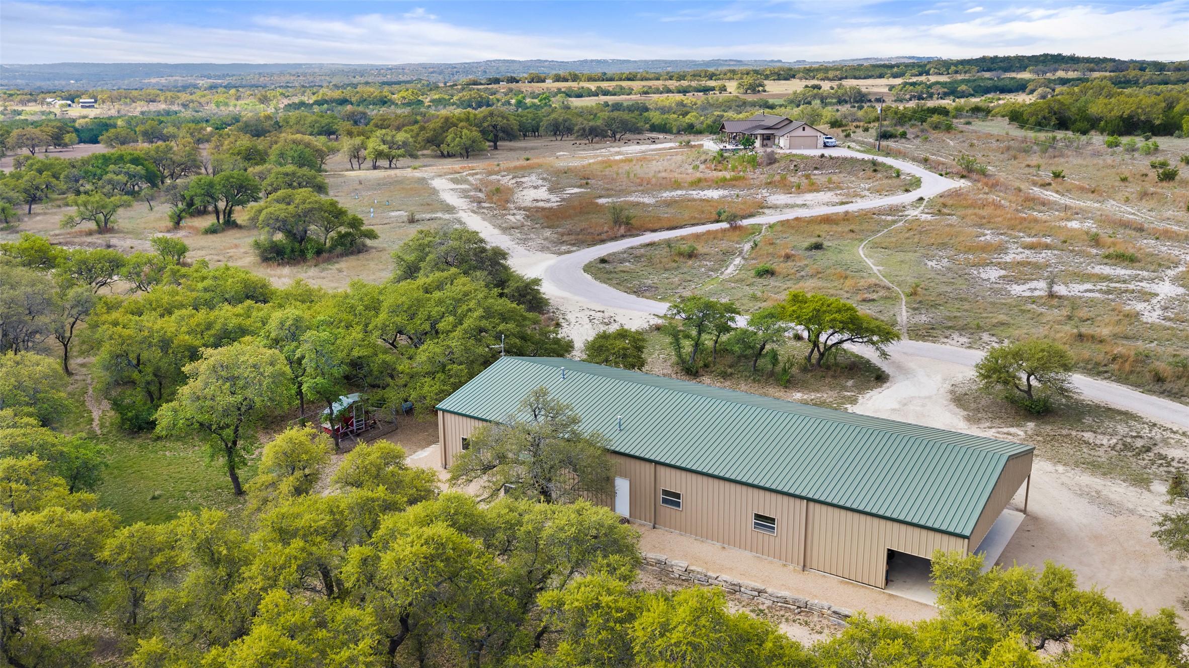 546 Lazy Oak Road Hye, TX 78635 - Photo 27 of 34 an aerial view of a house with a yard