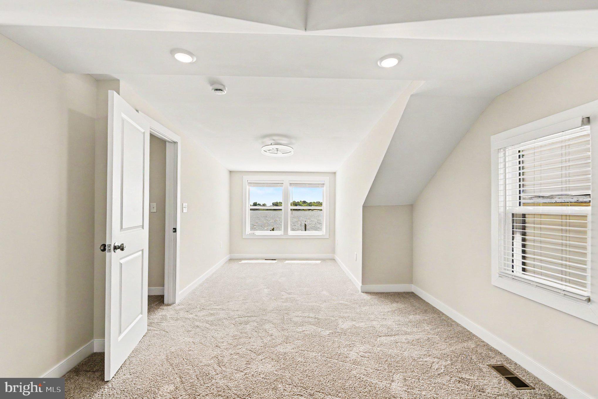 9135 Cuckold Point Road Sparrows Point, MD 21219 - Photo 21 of 44 a big room with windows and closet