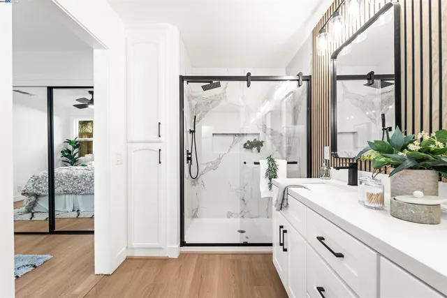 a view of bathroom with a tub shower and mirror