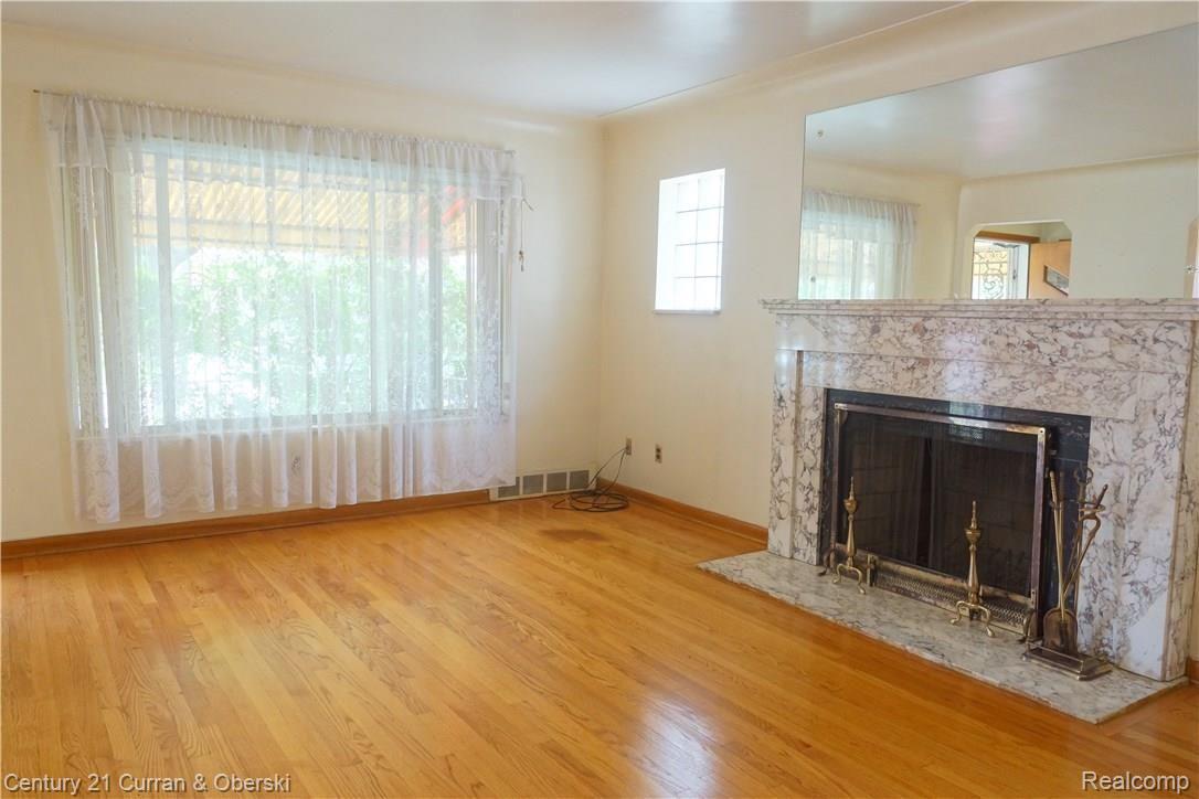 7644 Miller Road Dearborn, MI 48126 - Photo 3 of 33 05 - living room - fireplace and large window.jpg