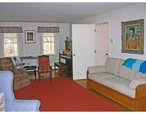 8 Pattee Road Harvard, MA 01451 - Photo 6 of 10 a living room with furniture a window and a table