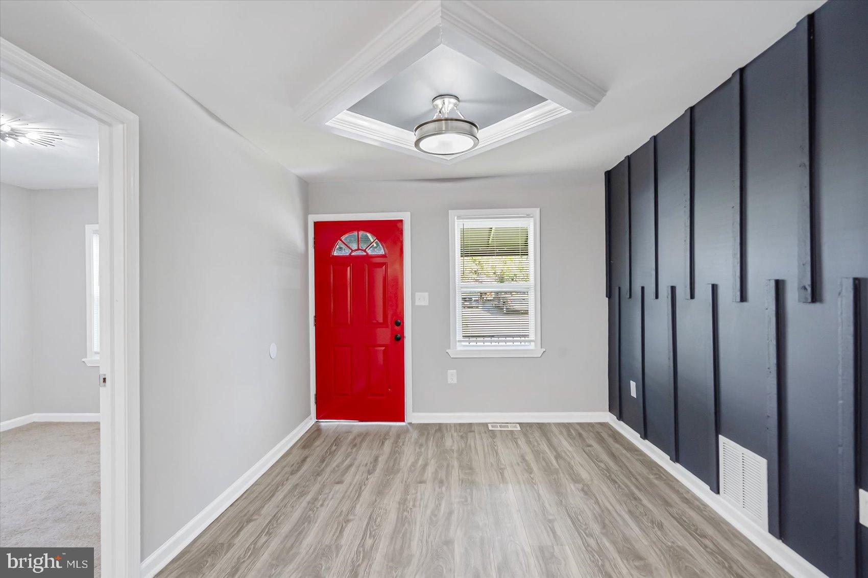 811 Rosedale Avenue Rosedale, MD 21237 - Photo 11 of 37 Chic entryway with bold red door accent.