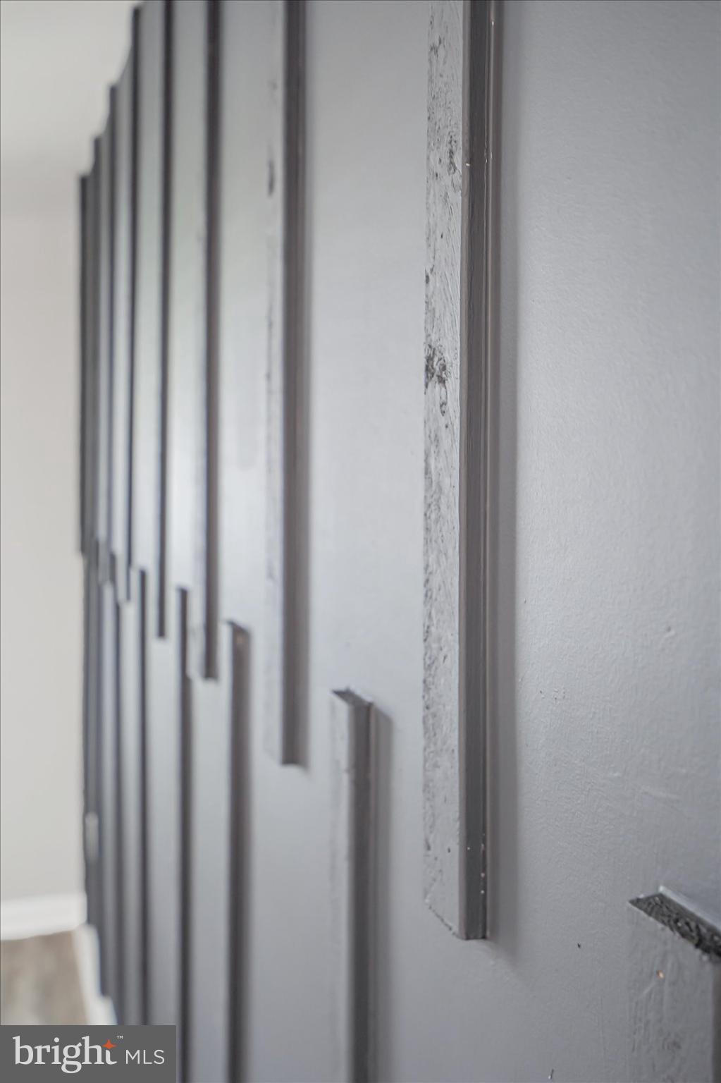 811 Rosedale Avenue Rosedale, MD 21237 - Photo 12 of 37 Textured wall with modern design elements.