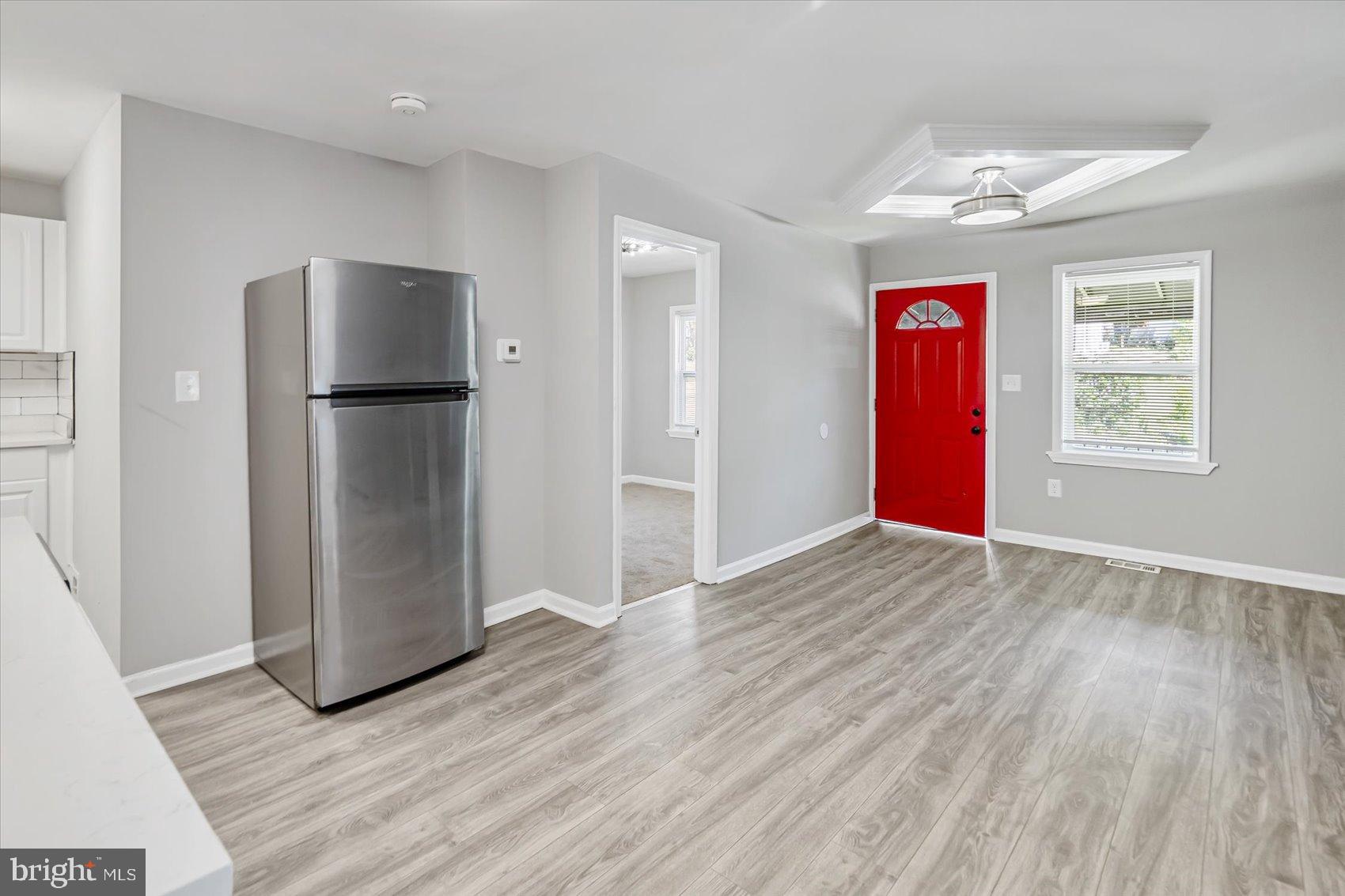 811 Rosedale Avenue Rosedale, MD 21237 - Photo 14 of 37 Bright and inviting open space with red accents.