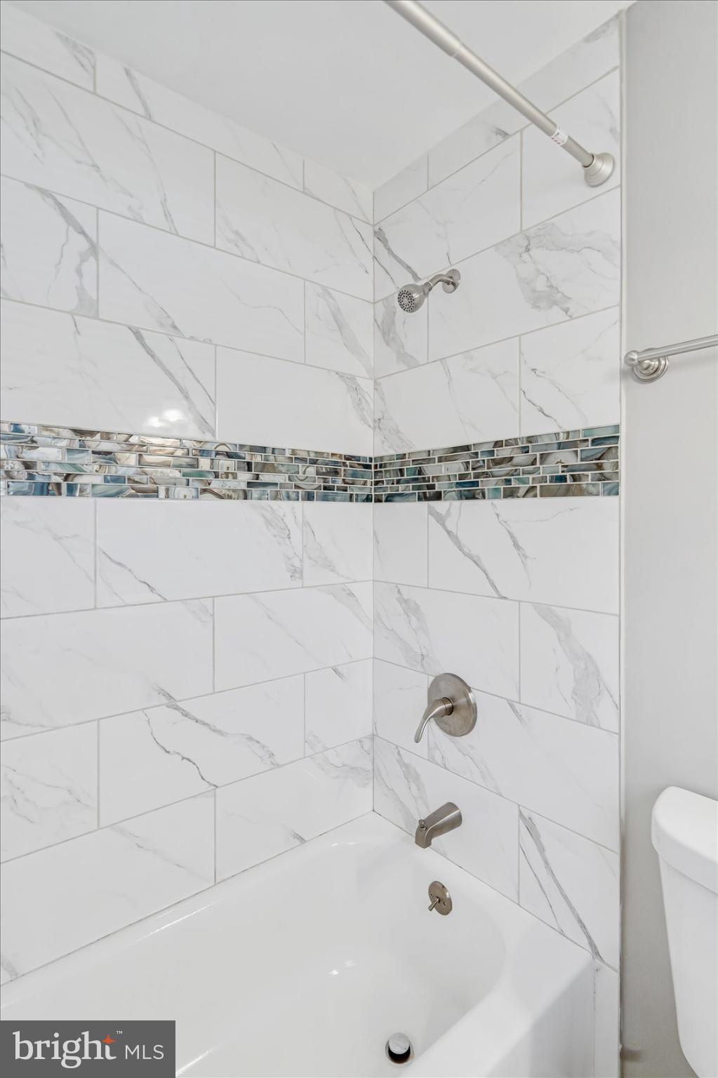 811 Rosedale Avenue Rosedale, MD 21237 - Photo 19 of 37 Elegant bathroom with modern tile accents.