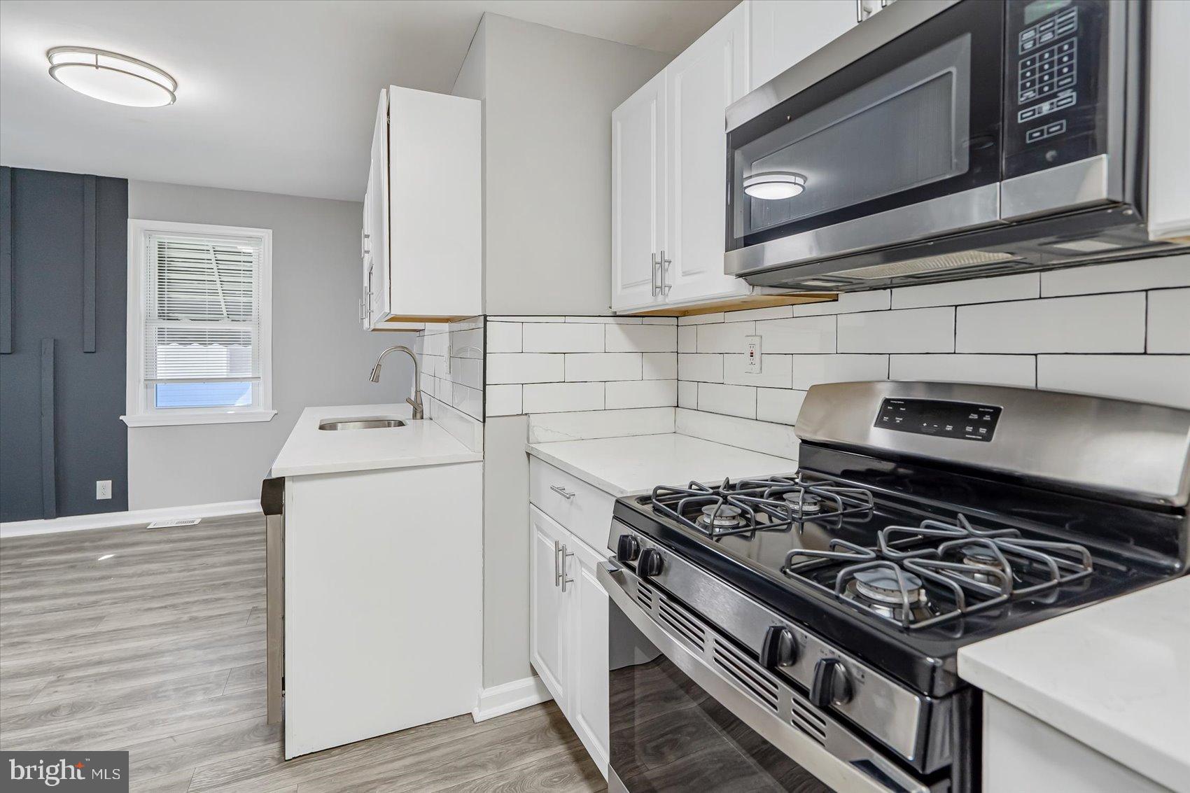 811 Rosedale Avenue Rosedale, MD 21237 - Photo 24 of 37 Modern kitchen with sleek finishes.