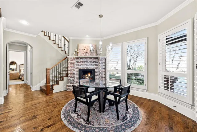 a view of a livingroom with furniture window and wooden floor