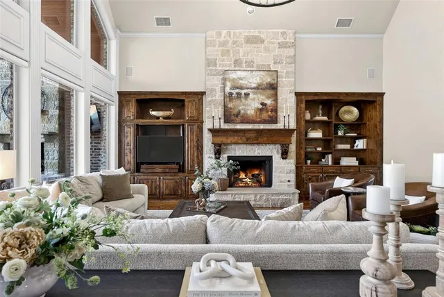 a living room with furniture and a fireplace