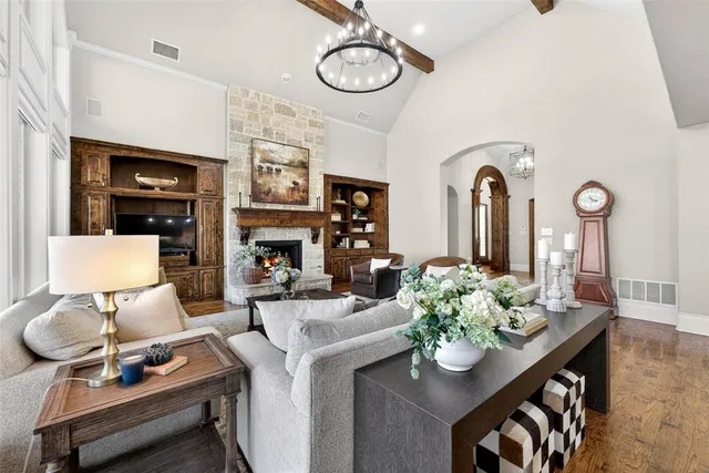 a view of living room with furniture and a fireplace