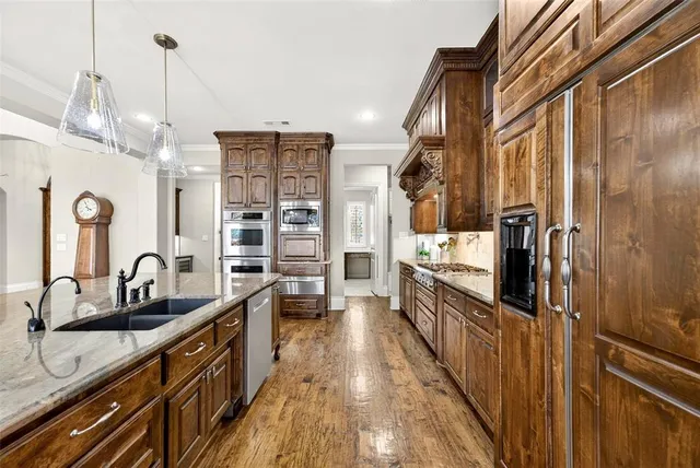 a kitchen with counter top space and stainless steel appliances