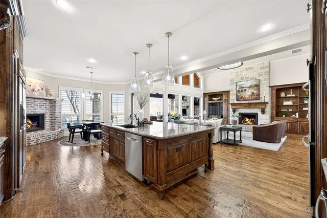 a living room with fireplace furniture and a wooden floor