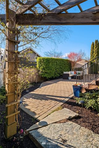 a view of a roof deck with furniture