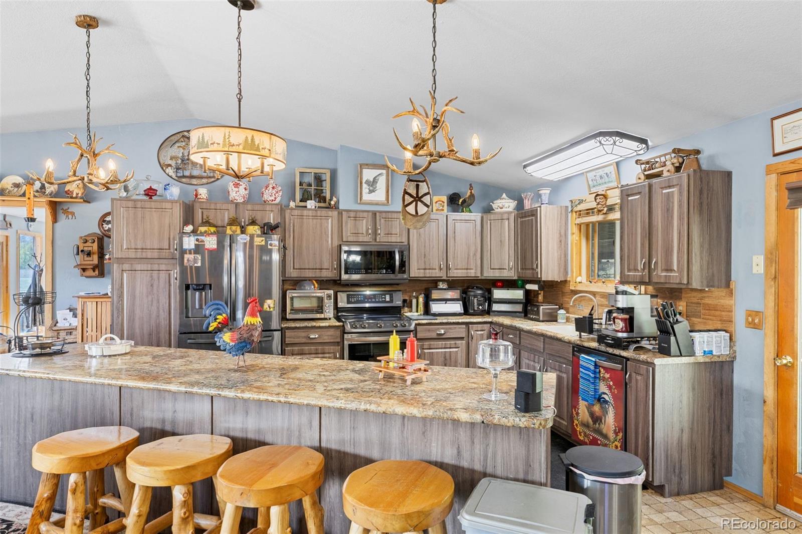 80 Fawn Road Bailey, CO 80421 - Photo 16 of 44 a kitchen with a table and chairs