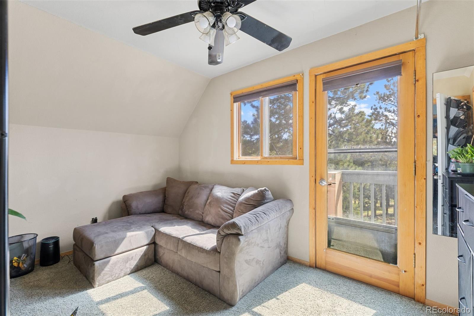 80 Fawn Road Bailey, CO 80421 - Photo 25 of 44 a living room with furniture and a window