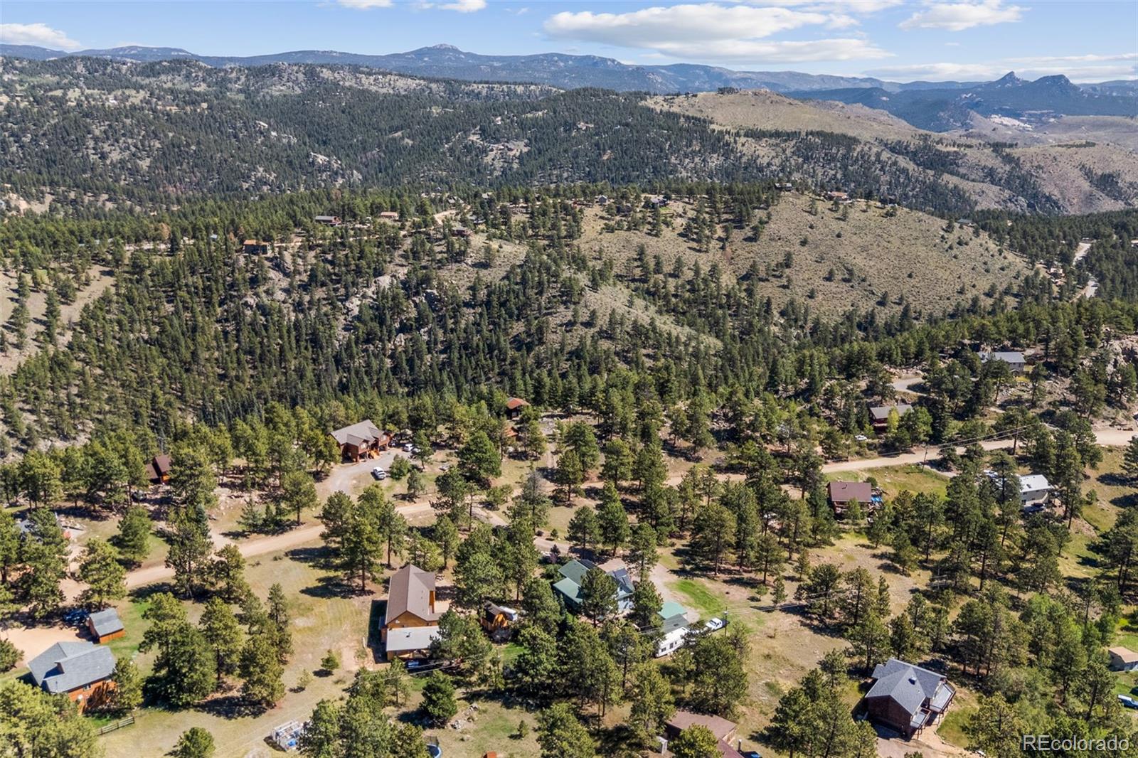 80 Fawn Road Bailey, CO 80421 - Photo 43 of 44 an aerial view of house with yard and mountain view in back
