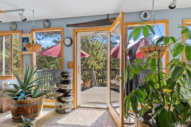 a living room with furniture a flat screen tv and a window