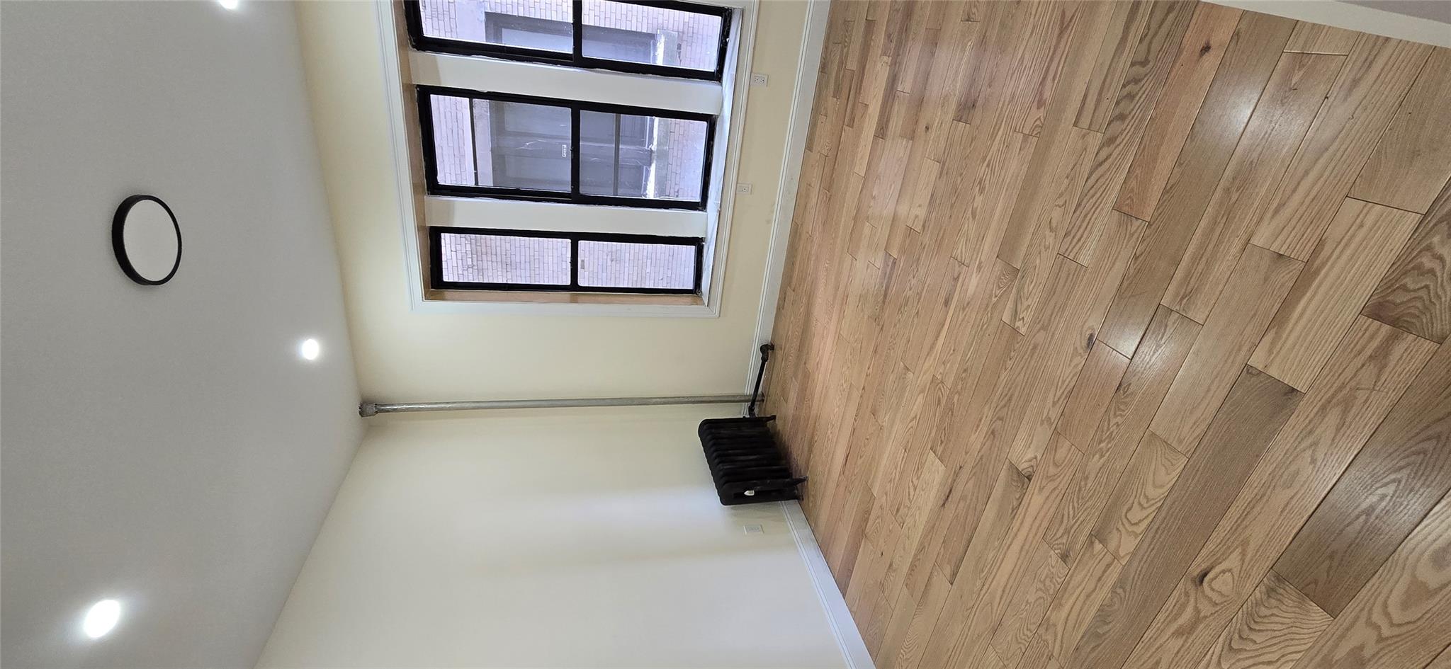 618 Riverside Drive, Unit 24 Manhattan, NY 10031 - Photo 4 of 16 Spare room with light wood-style floors, baseboards, and recessed lighting