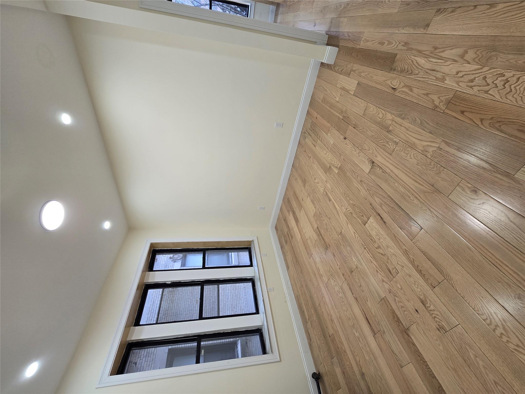 618 Riverside Drive, Unit 24 Manhattan, NY 10031 - Photo 9 of 16 Empty room featuring baseboards, light wood-type flooring, and recessed lighting