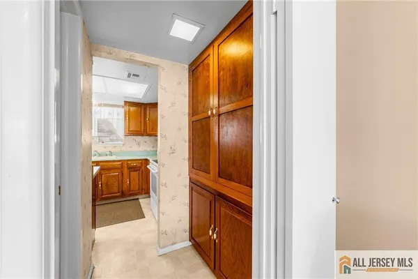 a en suite bathroom with a sink and mirror
