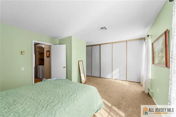 a bed room with a bed and a window