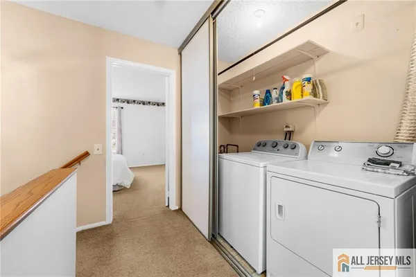 a storage room with washer and dryer