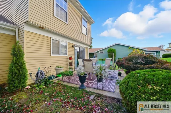 a view of a house with a backyard and a garden